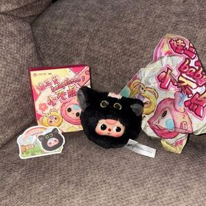 This is a Baby Three Tiny Animal - Black Kitty plush toy. 
It is a collectible